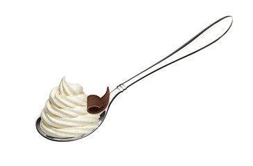 Whipped frozen yogurt or ice cream with chocolate curl in spoon isolated on white background.