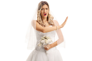 Fototapeta na wymiar Angry bride gesturing stop with her hand