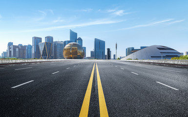 Obraz premium Empty road floor surface with modern city landmark buildings of hangzhou bund Skyline,zhejiang,china