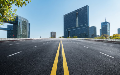 Fototapeta premium Empty road floor surface with modern city landmark buildings of hangzhou bund Skyline,zhejiang,china
