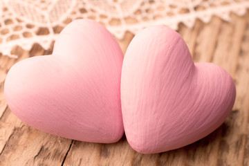 Fototapeta premium Livin coral heart on a wooden background. Valentines day greating card.