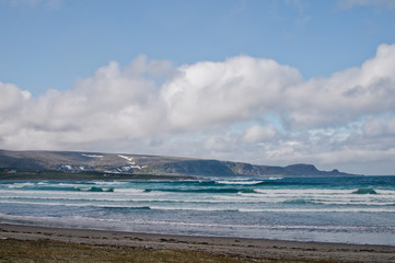 Coast and landscape of Northern Norway and strong waves of the Barents Sea