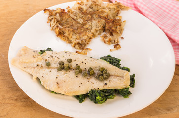 Poached Flounder Dinner on Spinach topped with Capers