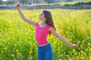 Naklejka na ściany i meble Teen girl selfie video photo spring meadow