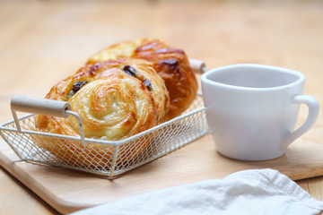 Danish bread with a cup of hot drink
