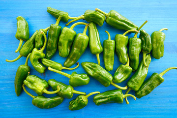 Padron peppers green on a wooden table