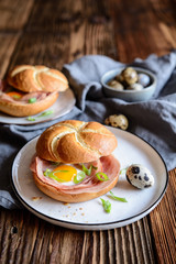 Baked rolls stuffed with ham, quail eggs and green onion