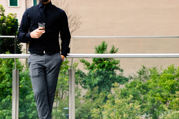 Man drinking a whiskey in Milan