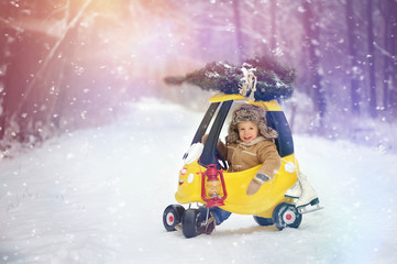 Child in winter. Fun little boy in the snow. The child is playing outside. Winter background....