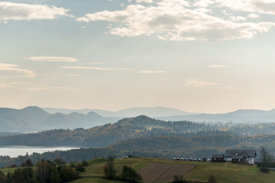 Polanczyk, Bieszczady Mountains, Poland: Sun rising over mountains. Views from near hill. In background Solina Lake.