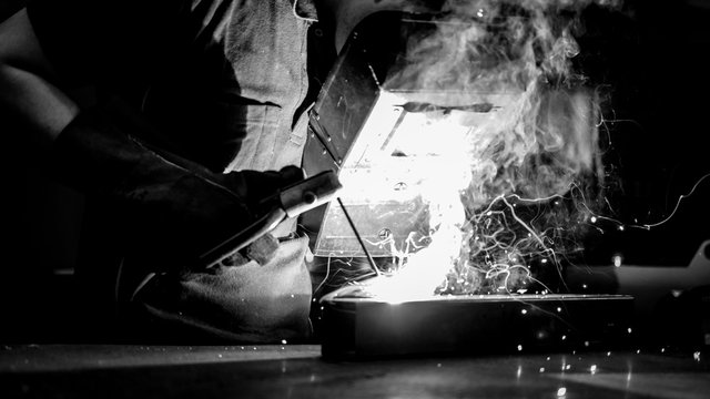 welder worker at work at a metalworking company
