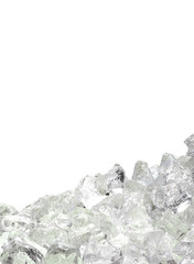 Melted clear ice cubes pile isolated on white background	