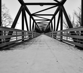 Abandoned railroad bridge hiking trail in winter