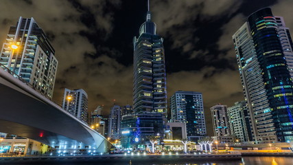 View of Dubai Marina Towers and canal in Dubai night timelapse hyperlapse