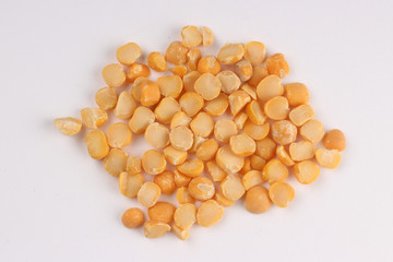 Yellow chopped peas on a white background