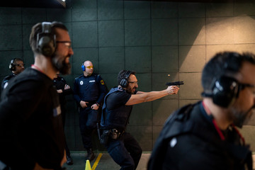 Police training in shooting gallery with short weapon. © OscarStock