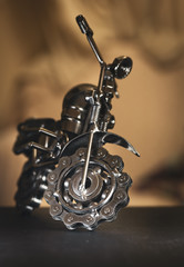 Close up (Macro) of Handmade metal toy motorcycle/motorbike made out of scrap metal pieces with short depth of view