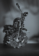 Close up (Macro) of Handmade metal toy motorcycle/motorbike made out of scrap metal pieces with short depth of view