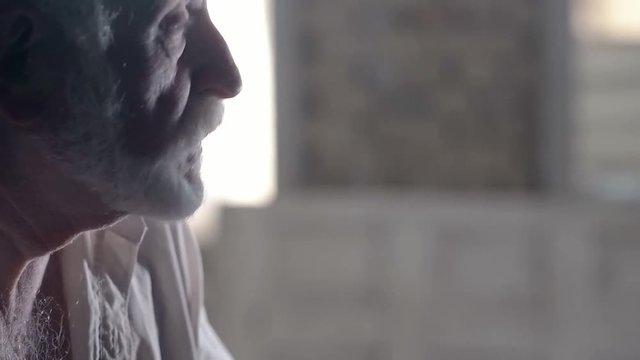 Soldier of the Russian army interrogates a suspect, an elderly man with a beard, under pain of execution, signs papers, the injustice of the NKVD, cynicism of the soldiers, the cruelty of the USSR