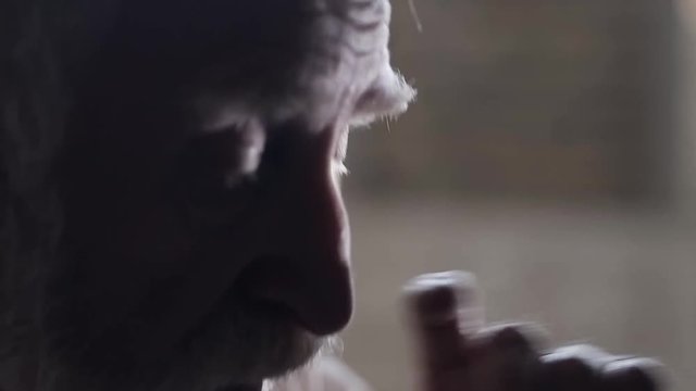 Soldier of the Russian army interrogates a suspect, an elderly man with a beard, under pain of execution, signs papers, the injustice of the NKVD, cynicism of the soldiers, the cruelty of the USSR