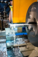 hydraulic lathe at work in a metalworking industry