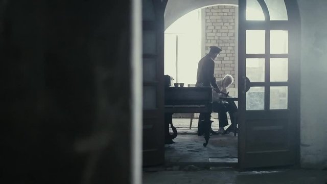 Soldier of the Russian army interrogates a suspect, an elderly man with a beard, under pain of execution, signs papers, the injustice of the NKVD, cynicism of the soldiers, the cruelty of the USSR