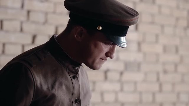 Soldier of the Russian army interrogates a suspect, an elderly man with a beard, under pain of execution, signs papers, the injustice of the NKVD, cynicism of the soldiers, the cruelty of the USSR