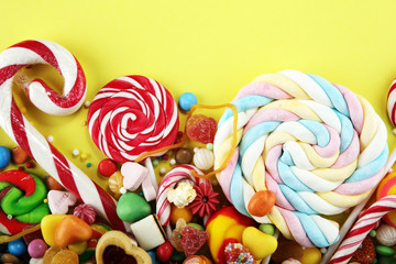 candies with jelly and sugar. colorful array of different childs sweets and treats.