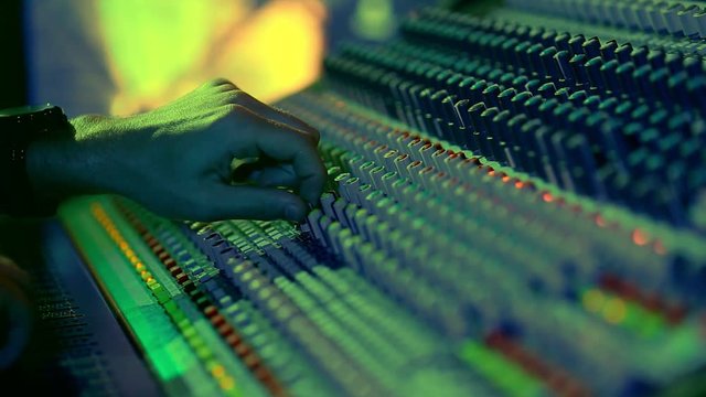 Big sound console, sound engineer at work