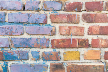 Colorful brick wall, half is red, half is blue