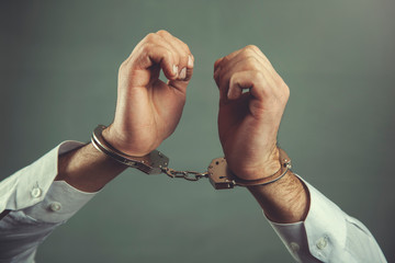 man hand handcuffs