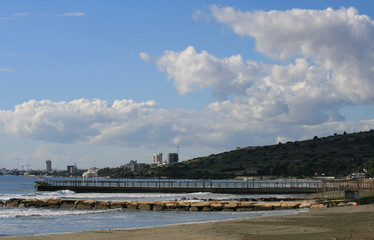 View of two piers, the sky, the Mediterranean sea and the Limassol seafront in December