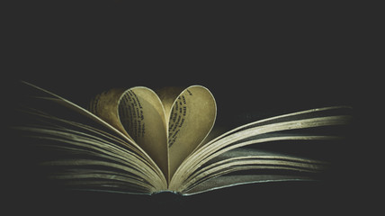 Old book and heart folded pages