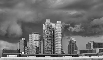 Dramatic sky over modern buildings in downtown New York, USA.