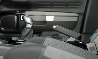manual gear shift and handbrake inside the passenger car