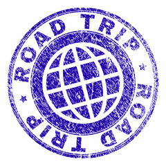 ROAD TRIP stamp print with distress texture. Blue vector rubber seal print of ROAD TRIP tag with unclean texture. Seal has words arranged by circle and planet symbol.
