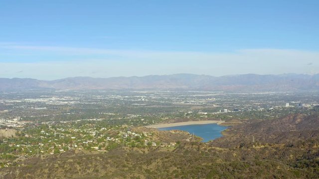 Aerial Drone Footage Overlooking Valley Moving Across Left