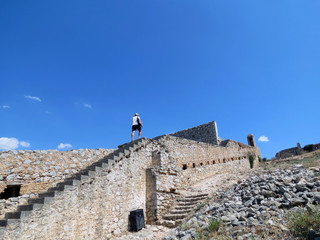 Europe,Greece,Nafplion,tourist inspects fortifications  clear summer day