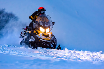 A rider on the snowmobile.