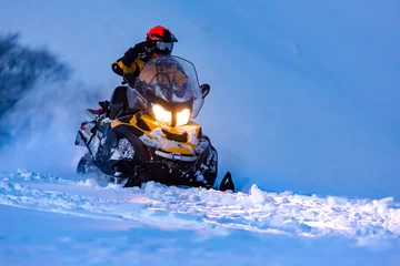 Fotobehang A rider on the snowmobile. © Taras