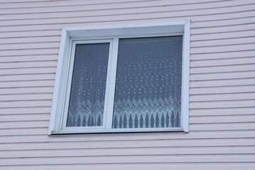 Fototapeta premium white window on a light pink plastic wall