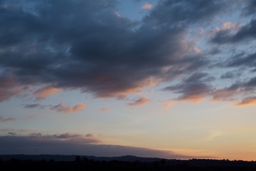 Fototapeta na wymiar mountain on sunset in blue and orange cloud sky background