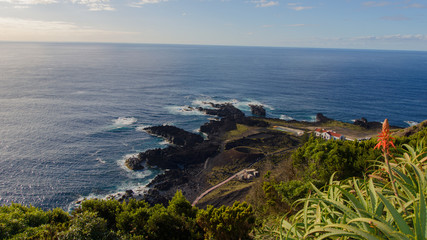 Azores island volcanic shore meets the blue ocean