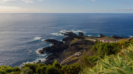 Azores island volcanic shore meets the blue ocean