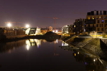 Fototapeta premium Holesovice above River Vltava in Night, the most cool district of Prague, and its Harbor, Czech Republic