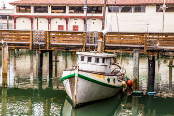 Fototapeta na wymiar Boat and dock at famous Fisherman's Wharf in San Francisco California