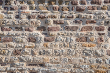 Pattern of bricks and stones at old middle age wall, Magdeburg, Germany