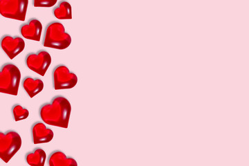 Red glossy hearts on pink background with copy space, mock up. Valentine's day, love, romance concept