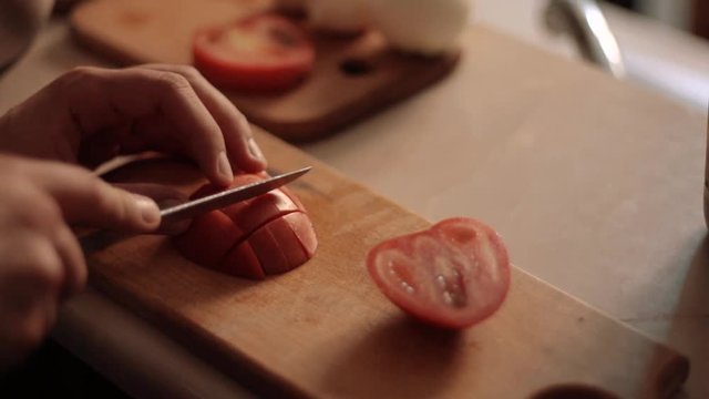 Cooking a dinner, chopping vegetables 