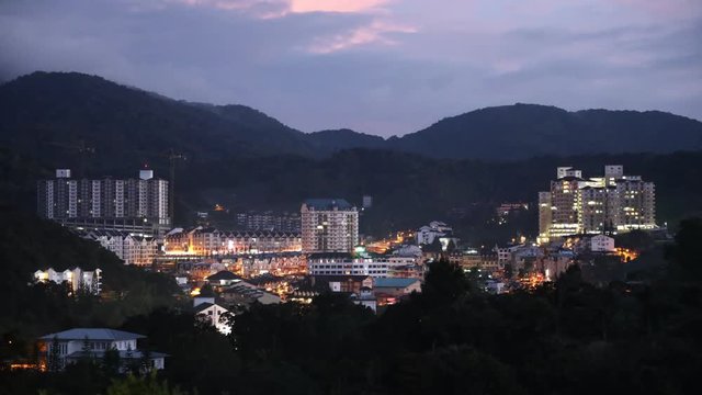 Sunrise panorama time-lapse of Brinchang town in Cameron Highland Malaysia with moving clouds 

